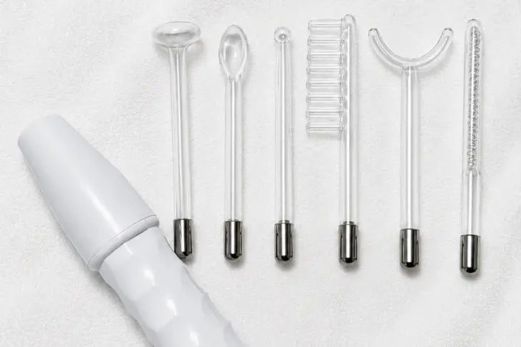 The LUMN wand and six glass attachments